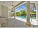 Covered patio overlooking a screened in private pool with lush landscaping at 307 Running Wind Ln, Maitland, FL 32751