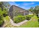 Enclosed screened-in patio with lush tropical landscaping, providing a private outdoor retreat in a serene setting at 307 Running Wind Ln, Maitland, FL 32751