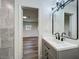 Bathroom featuring modern vanity and tiled shower at 3321 Mahalia Pl, Orlando, FL 32805