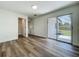 Bedroom featuring wood floors, a closet, and sliding glass door leading to the backyard at 3321 Mahalia Pl, Orlando, FL 32805