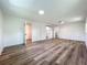 Open bedroom with closet, modern sliding door, and wood flooring at 3321 Mahalia Pl, Orlando, FL 32805
