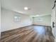 A spacious bedroom with wood flooring and plenty of natural light from the windows at 3321 Mahalia Pl, Orlando, FL 32805