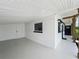 Large white carport with built in storage and access to front door at 3321 Mahalia Pl, Orlando, FL 32805