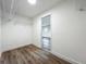 Walk-in closet featuring wood flooring and wire shelving at 3321 Mahalia Pl, Orlando, FL 32805
