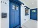 Close-up view of the blue front door with decorative glass and modern hardware at 3321 Mahalia Pl, Orlando, FL 32805