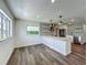 Bright kitchen featuring an island, modern appliances, and stylish backsplash at 3321 Mahalia Pl, Orlando, FL 32805