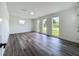 Bright and airy living room with sleek flooring and large windows providing abundant natural light at 3321 Mahalia Pl, Orlando, FL 32805