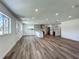 Open-concept living space leading into a renovated kitchen with island at 3321 Mahalia Pl, Orlando, FL 32805