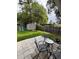 Spacious backyard patio and lawn area are fenced and include a storage shed and play slide at 34 W Bob White St, Apopka, FL 32712