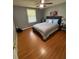 Bright bedroom with laminate floors, ceiling fan and grey decor at 34 W Bob White St, Apopka, FL 32712