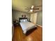 Bright bedroom with laminate floors, ceiling fan and grey decor at 34 W Bob White St, Apopka, FL 32712