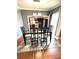 Elegant dining room featuring stylish glass table and modern light fixture at 34 W Bob White St, Apopka, FL 32712