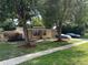 Charming home with mature trees and a well-maintained lawn and landscaping at 34 W Bob White St, Apopka, FL 32712
