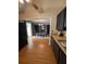 Bright kitchen with black cabinets, bamboo countertops, and an open layout to the dining room at 34 W Bob White St, Apopka, FL 32712