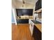 Functional kitchen with black cabinetry and vaulted ceilings at 34 W Bob White St, Apopka, FL 32712