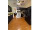 Spacious kitchen with black cabinets and modern appliances adjacent to the living room at 34 W Bob White St, Apopka, FL 32712