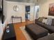 Comfortable living room with wood floors, a large sectional couch, and modern decor at 34 W Bob White St, Apopka, FL 32712