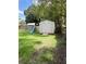 Backyard storage shed on a sunny lot features a ramp and play slide nearby at 34 W Bob White St, Apopka, FL 32712
