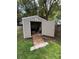Spacious backyard shed with open door, ramp, and concrete blocks for easy access at 34 W Bob White St, Apopka, FL 32712