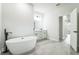 Luxurious bathroom with freestanding tub, double vanity, and modern fixtures at 3832 Sw 157Th Place Rd, Ocala, FL 34473