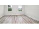 A bedroom featuring modern floors and windows at 3832 Sw 157Th Place Rd, Ocala, FL 34473