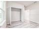 Bright bedroom with light wood-look floors, a closet, and white walls at 3832 Sw 157Th Place Rd, Ocala, FL 34473