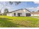 A modern home featuring clean lines, a well manicured lawn, and an attached two car garage at 3832 Sw 157Th Place Rd, Ocala, FL 34473