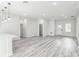 Open-concept living area with bright neutral walls and durable modern flooring throughout at 3832 Sw 157Th Place Rd, Ocala, FL 34473