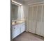 Bathroom featuring tile floors, single vanity, and closet at 3917 Lake Mira Dr, Orlando, FL 32817