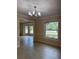 This light-filled dining room features a decorative chandelier, and great natural light at 3917 Lake Mira Dr, Orlando, FL 32817