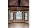 Dining area featuring large windows offering ample natural light, tiled floors, and a chandelier at 3917 Lake Mira Dr, Orlando, FL 32817