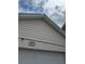 Exterior peak of home featuring siding, address number and garage at 3917 Lake Mira Dr, Orlando, FL 32817