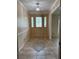 Charming foyer features decorative tile flooring and a decorative glass front door, providing a welcoming entrance at 3917 Lake Mira Dr, Orlando, FL 32817