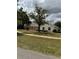 Charming single-story home featuring well-maintained front yard with green grass and beautiful landscaping at 3917 Lake Mira Dr, Orlando, FL 32817
