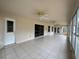 The screened-in patio offers an outdoor living space with ceiling fans at 3917 Lake Mira Dr, Orlando, FL 32817