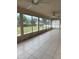 The screened-in patio offers an abundance of natural light at 3917 Lake Mira Dr, Orlando, FL 32817