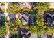Aerial view of the home surrounded by mature trees and manicured lawns at 394 Baymoor Way, Lake Mary, FL 32746