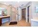 Bright bathroom featuring a glass shower with tile surround and vanity with ample counter space at 394 Baymoor Way, Lake Mary, FL 32746