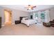 Large bedroom with neutral walls, large windows, carpet floors, and natural light throughout at 394 Baymoor Way, Lake Mary, FL 32746