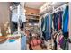 Walk-in closet with built-in shelving and rods, providing abundant storage for clothes, shoes, and accessories at 394 Baymoor Way, Lake Mary, FL 32746