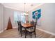 Cozy dining area featuring a wood table, neutral walls, and ample natural light at 394 Baymoor Way, Lake Mary, FL 32746