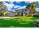 Stunning two-story home with a well-maintained lawn, mature trees, and a spacious three-car garage at 394 Baymoor Way, Lake Mary, FL 32746