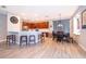 Kitchen and dining area with dark wood cabinets, stainless appliances, breakfast bar, and tile floors at 394 Baymoor Way, Lake Mary, FL 32746