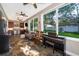 Spacious living area with tile floors, a piano, and a wet bar, perfect for entertaining guests at 394 Baymoor Way, Lake Mary, FL 32746