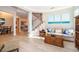Open living area with wood-look tile floors and staircase, perfect for entertaining and relaxation at 394 Baymoor Way, Lake Mary, FL 32746