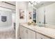 Themed bathroom showing double sinks, marble countertops, and recessed lighting at 421 Southfield St, Kissimmee, FL 34747