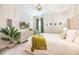 Bedroom with a queen bed, TV, light gray dresser, natural light, and a relaxing atmosphere at 421 Southfield St, Kissimmee, FL 34747