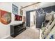 Themed bedroom showing wall decor, wall-mounted tv and adjoining bathroom at 421 Southfield St, Kissimmee, FL 34747