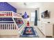 Whimsical bedroom featuring a bunk bed, TV, and star-themed decor at 421 Southfield St, Kissimmee, FL 34747