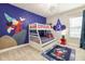 Whimsical bedroom with custom Mickey Mouse wall art, a bunk bed, and playful decor at 421 Southfield St, Kissimmee, FL 34747